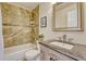 Well-lit bathroom with a tub-shower combination and granite sink vanity and new fixtures at 21238 Snowshoe Ln, Parker, CO 80138