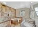 Bathroom with walk-in shower, soaking tub, and dual sinks with granite countertops for a luxurious feel at 21238 Snowshoe Ln, Parker, CO 80138