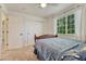 This bedroom features plush carpet, a ceiling fan, and a bright window for natural light at 21238 Snowshoe Ln, Parker, CO 80138