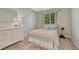 Cozy bedroom featuring a comfortable bed, neutral-colored walls, and natural light at 21238 Snowshoe Ln, Parker, CO 80138