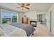 Comfortable bedroom with fireplace, attached desk space, and large window offering ample natural light at 21238 Snowshoe Ln, Parker, CO 80138