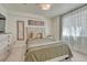 A cozy bedroom with a comfortable bed, dresser, and decor at 21238 Snowshoe Ln, Parker, CO 80138