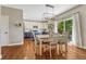 Bright eat-in kitchen features modern light fixture and patio access at 21238 Snowshoe Ln, Parker, CO 80138