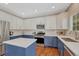 Updated kitchen features white countertops, stainless appliances, and island at 21238 Snowshoe Ln, Parker, CO 80138