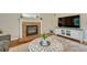 Living room features a brick fireplace with decorative mantle at 21238 Snowshoe Ln, Parker, CO 80138