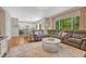 Open concept living room flows into modern eat-in kitchen at 21238 Snowshoe Ln, Parker, CO 80138