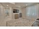 Relaxing living room with TV and comfortable seating with lots of natural light at 21238 Snowshoe Ln, Parker, CO 80138
