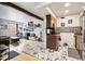 Spacious open-concept living area with kitchen featuring updated flooring at 3623 S Sheridan Blvd # 12, Denver, CO 80235