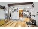 Inviting living space with light hardwood floors, stylish decor, and open flow to the kitchen at 3623 S Sheridan Blvd # 12, Denver, CO 80235