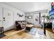 Cozy living room with comfortable seating, natural light, and wood flooring at 3623 S Sheridan Blvd # 12, Denver, CO 80235