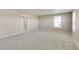 Spacious bedroom with neutral walls, carpet flooring, and access to bathroom at 18134 Prince Hill Cir, Parker, CO 80134