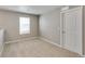 Simple bedroom with neutral walls, carpet flooring, and a window at 18134 Prince Hill Cir, Parker, CO 80134