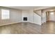 Living room with fireplace, hardwood floors, and access to the kitchen at 18134 Prince Hill Cir, Parker, CO 80134