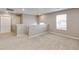 Spacious loft area with carpet flooring and two doors at 18134 Prince Hill Cir, Parker, CO 80134