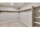 Spacious walk-in closet with shelves and hanging rods at 18134 Prince Hill Cir, Parker, CO 80134