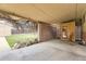 Covered patio featuring breeze block walls, a concrete floor, and a sauna, providing a versatile outdoor living area at 7251 Larsh Dr, Denver, CO 80221