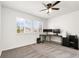 Bedroom featuring dual windows, ceiling fan, and space for a desk or seating at 9847 Helena Ct, Commerce City, CO 80022