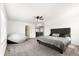 Spacious main bedroom with neutral carpeting, a ceiling fan, and an en-suite bathroom at 9847 Helena Ct, Commerce City, CO 80022