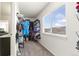 Walk-in closet with shelving and hanging space, plus a window for natural light at 9847 Helena Ct, Commerce City, CO 80022