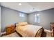 A cozy bedroom featuring a comfortable bed, soft lighting, and a dresser for storage, creating a serene retreat at 10621 Julian St, Westminster, CO 80031