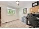 Bedroom featuring a ceiling fan, large window and a view to exterior foliage at 10621 Julian St, Westminster, CO 80031