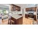 Updated kitchen with granite countertops, stainless steel appliances, and hardwood floors at 10621 Julian St, Westminster, CO 80031