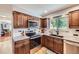 Updated kitchen with granite countertops, stainless steel appliances, and modern cabinetry at 10621 Julian St, Westminster, CO 80031