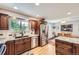 Well-lit kitchen with granite countertops, stainless steel appliances, and hardwood flooring at 10621 Julian St, Westminster, CO 80031