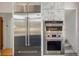 This kitchen features stainless steel refrigerator, oven and microwave at 2155 N High St, Denver, CO 80205
