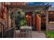 Charming backyard patio with pergola, dining set, and view of outdoor bar area at 2155 N High St, Denver, CO 80205