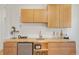 A stylish bar area features wooden countertops, cabinets, mini-fridge, and charming decor at 2155 N High St, Denver, CO 80205
