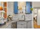 Elegant bar area with display shelving, built-in cooler, and ample counter space at 2155 N High St, Denver, CO 80205