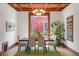 Elegant dining room with a wooden ceiling and an abundance of natural light at 2155 N High St, Denver, CO 80205