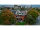 Beautiful brick home with a manicured lawn and mature trees at 2155 N High St, Denver, CO 80205