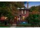 Charming brick home with lush landscaping and a welcoming entrance at 2155 N High St, Denver, CO 80205