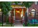 Inviting front porch with lion statues and an elegant entrance to the home at 2155 N High St, Denver, CO 80205