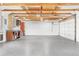 Spacious garage featuring painted walls and exposed beams at 2155 N High St, Denver, CO 80205
