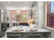 Stylish kitchen showcasing stainless steel appliances, copper sink, breakfast bar, and sleek blue cabinets at 2155 N High St, Denver, CO 80205