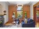Inviting living room featuring exposed brick and a large window with neighborhood views at 2155 N High St, Denver, CO 80205