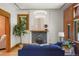 Cozy living room with a decorative fireplace and ample natural light at 2155 N High St, Denver, CO 80205