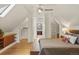 Main bedroom showcasing wood floors, built in storage and two walk in closets at 2155 N High St, Denver, CO 80205