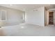 Bright, carpeted bedroom featuring natural light from multiple windows and neutral-colored walls at 14404 Shasta Daisy Pt, Parker, CO 80134