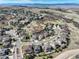 Aerial view of the picturesque neighborhood with winding streets, mature trees, and well-maintained homes against mountain backdrop at 5830 Jasper Pointe Cir, Castle Pines, CO 80108