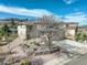 Stunning aerial view of a two-story home with a well-manicured yard, stone accents, and a serene setting at 5830 Jasper Pointe Cir, Castle Pines, CO 80108