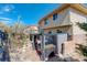 Inviting backyard with a hot tub, patio, rock landscaping, and privacy provided by mature trees at 5830 Jasper Pointe Cir, Castle Pines, CO 80108