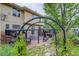 Spacious backyard featuring an outdoor patio, dining area, hot tub, and mature landscaping at 5830 Jasper Pointe Cir, Castle Pines, CO 80108