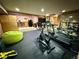 Recreational room featuring exercise equipment, a wet bar, and plenty of space for entertaining at 5830 Jasper Pointe Cir, Castle Pines, CO 80108