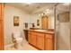 This bathroom boasts a large vanity with plenty of storage and a shower with glass door at 5830 Jasper Pointe Cir, Castle Pines, CO 80108