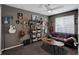 Unique bedroom featuring a gray sofa, dark walls, and a variety of musical instruments and decor at 5830 Jasper Pointe Cir, Castle Pines, CO 80108