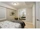 A cozy bedroom with a large, mirrored closet and neutral tones for a relaxing atmosphere at 5830 Jasper Pointe Cir, Castle Pines, CO 80108